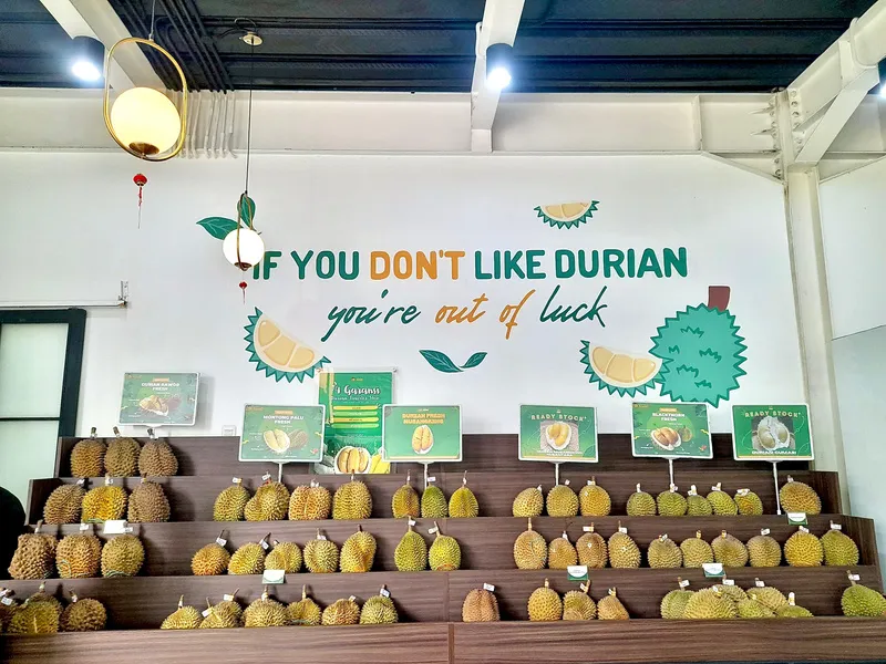 Dinding toko bertuliskan If you don't like durian, you're out of luck